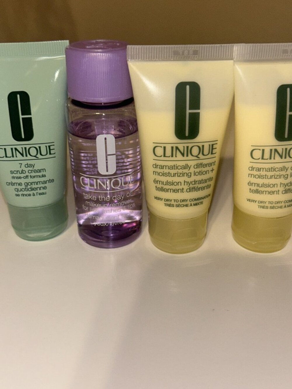 Clinique 4pc Skin Care Travel Set 7-Day Scrub Cream,Take The Day Off & 2 Lotions